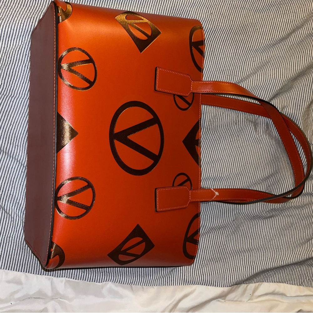 Orange and gold label bag